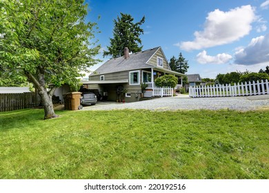 House With Covered Parking Spot And Gravel Driveway