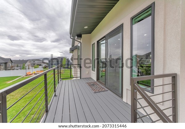 House\
deck of a house with sliding glass and screen\
door