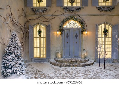 House Decorated For Christmas Outside, Courtyard. Vintage Street Interior With Tree, Door And Lights In Windows. Winter Christmas Background.