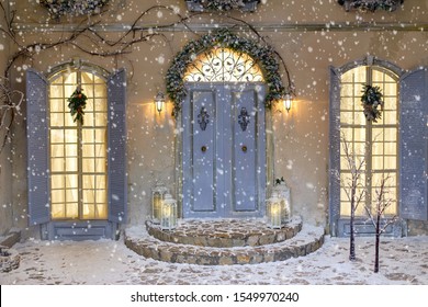 House Decorated For Christmas Outside. Vintage Courtyard Interior With Stairs, Porch, Door And Lights In Windows. Winter Christmas Background.