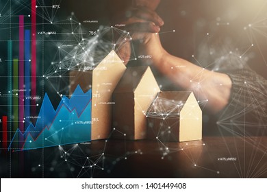house design decision ideas concept with man hand and virtual business graph chart diagram