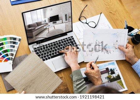 House Designer And Decorators Using Computer For Design