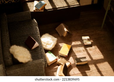 The House For The Doll Is Scattered Books.T He Roombox Is An Inside View Of Scattered Books And Whindow. Interior Of A Miniature House.