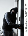 House, door and man as criminal with tools for robbery, stealing and manipulation of lock mechanism. Home invasion, thief and crime for trespass, illegal activity and sneaky person for mission