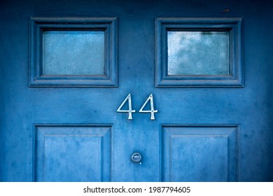 House Door Number 44 On A Dark Blue Door