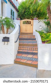 House entrance stairs to the front gate with tiles steps and ornate tile risers at San Clemente, CA