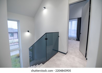 House Entryway With White Walls And Steps