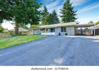 House Exterior. Entrance Porch With Yellow Door And French Windows. Asphalt Driveway