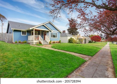 House Exterior. View Of Front Yard With Walkway And Small Entrance Porch