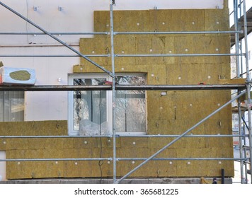 House External Wall Insulation With Fiberglass. Energy Saving Concept. Fiber Glass Insulation Delivers Proven Performance  At A Greater Value Compared To Other Types Of Insulation Materials.