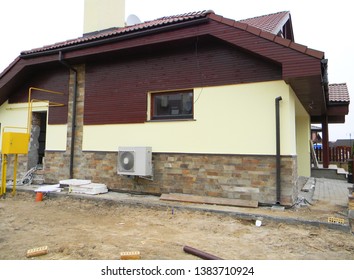 House Facade Under Construction With Rain Gutter Downspout Pipe, House Foundation Wall, Air Duct                    