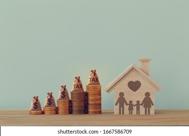 House And Family Members, US Dollar Bags On Rows Of Rising Coins On Table. Home Loan, Cost Of Living, Financial Concept : Depicts Budget Spending Limit And Sustain Certain Standard Of Living.