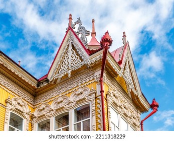 House with firebirds, Tomsk. Russian style in architecture. Wooden house, Tomsk, Russia. Beautiful carved elements of Russian Northern architecture