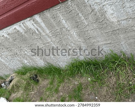 House foundation close up highlighting structural concrete base and exterior residential construction material detail