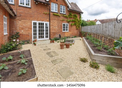 House And Garden With A Terrace Patio And French Doors, Gravel Hard Landscaping And York Stone Path