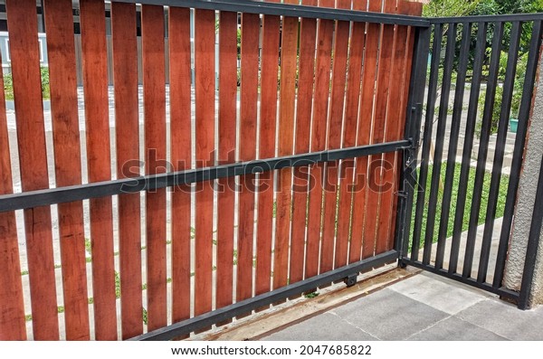 House Gate with Wooden Planks. Brown Gate For\
House Security.