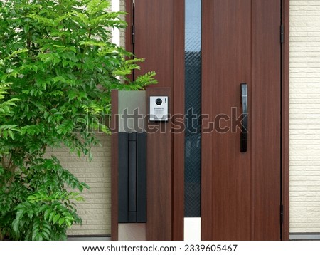 House gatepost with mailbox and intercom installed