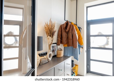 House Hallway Interior With Clothes And Furniture