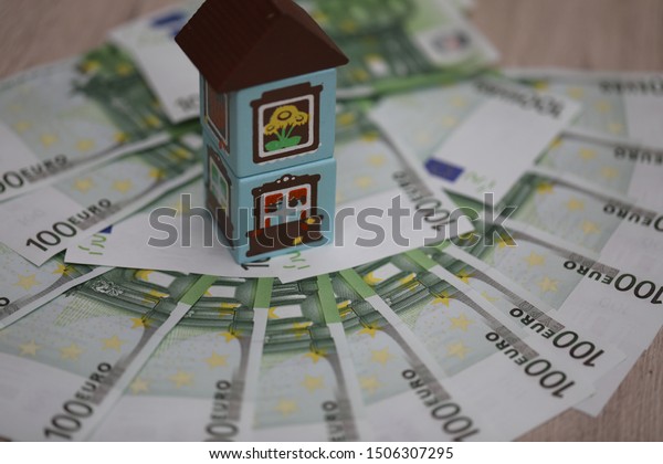 house, home, car, keys, property on money\
background, saving money and\
property
