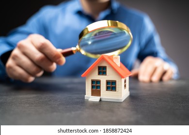 House Or Home Inspection Using Magnifying Glass. Tax And Insurance