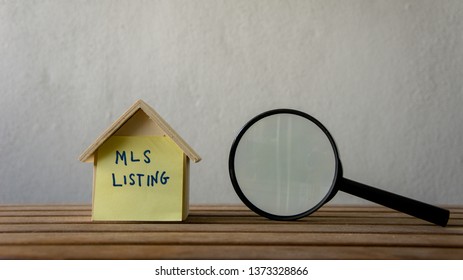 House Or Home Model With Text MLS (Multiple Listing Service) Listing (For Sale By Owner). Property Or Real Estate Concept.