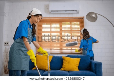 House keeper clean living room. Cleaning service and house keeping concept.