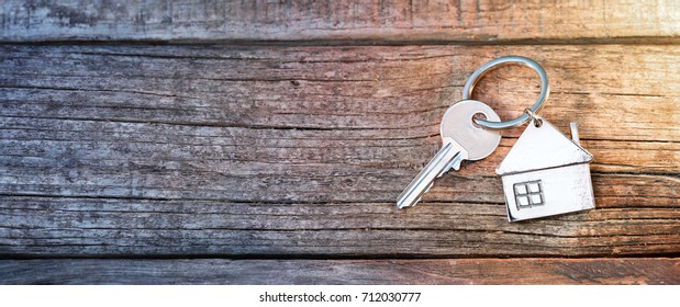 House Key And Key Chain On Wooden Table
