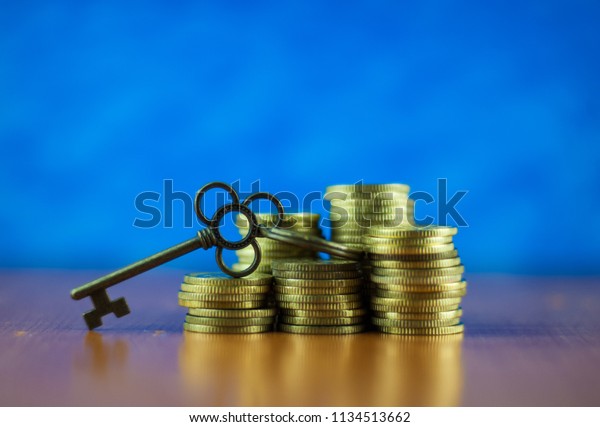 House key and
stack coins. Key success
concept