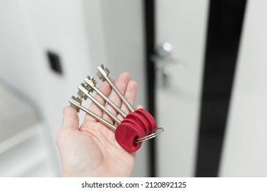 House Key In Womans Hands, Concept Of Moving Or Rent Appartment.