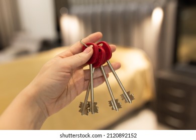 House Key In Womans Hands, Concept Of Moving Or Rent Appartment.