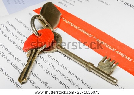 House keys on a bank letter informing customer of Mortgage Arrears and repossession  with bank statement