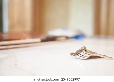 house keys on the ring on table in a room. To forget keys at home concept ,