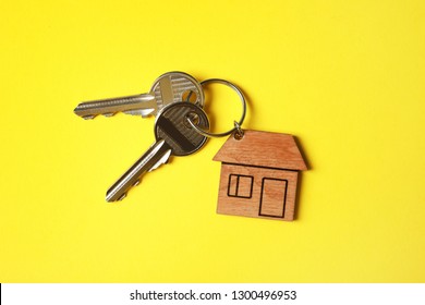 House Keys With Trinket On Color Background, Top View