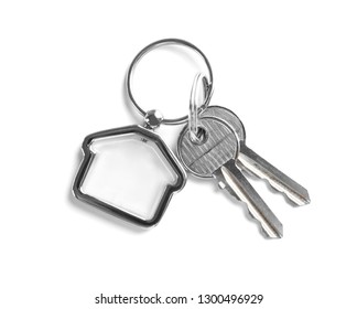 House Keys With Trinket On White Background, Top View