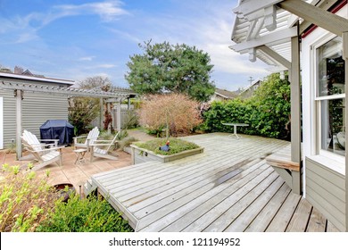 House Large Deck And Backyard During Early Spring.