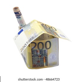House made from 200 euro banknotes with the chimney made from 10 dollar banknote, over white