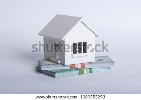 House Made of Cash Money Isolated on White Background.