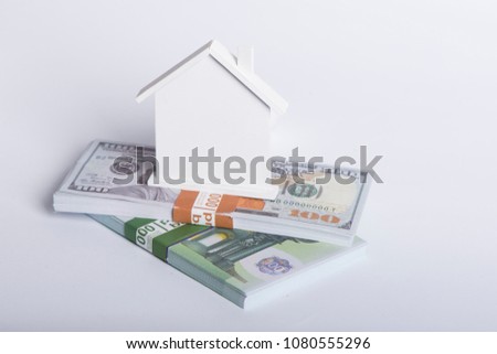 House Made of Cash Money Isolated on White Background.