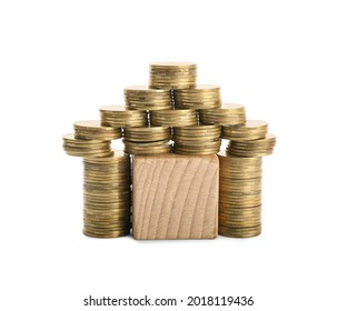 House made of coins on white background. Concept of buying real estate