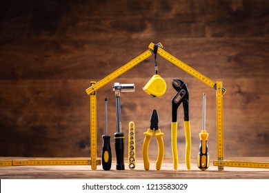 House Made Up Of Measuring Tape Over Tools With Various Worktools - Shutterstock ID 1213583029