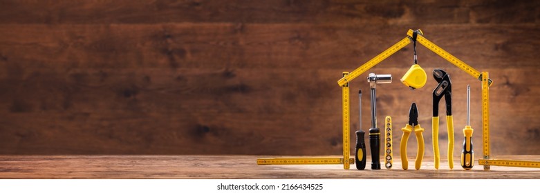 House Made Up Of Measuring Tape Over Tools With Various Worktools - Shutterstock ID 2166434525