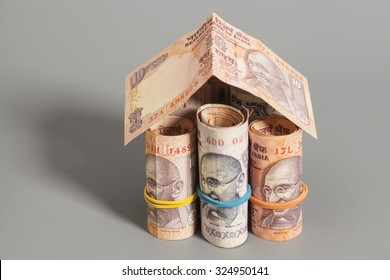 House Made Roll Of Indian Rupee Banknotes Isolated On Gray