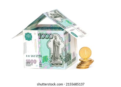 A house made of rubles, a stack of coins, isolated on a white background