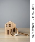 House and magnifying glass. Take a mortgage. Investments in immovable assets. Property Inspection before purchase to uncover any issues. Searching for real estate to buy. Find a suitable home.