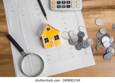 house model with coins on document - Shutterstock ID 1898001769