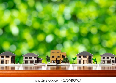 House model and green blur background