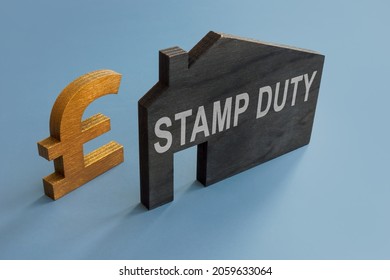 House Model With Inscription Stamp Duty And Sign Of Pound.