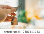 House model and key in home insurance broker agent ‘s hand or in salesman person. Real estate agent offer house, property insurance and security, affordable housing concepts