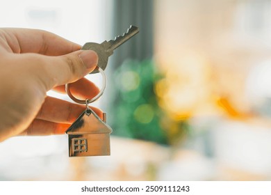 House model and key in home insurance broker agent ‘s hand or in salesman person. Real estate agent offer house, property insurance and security, affordable housing concepts