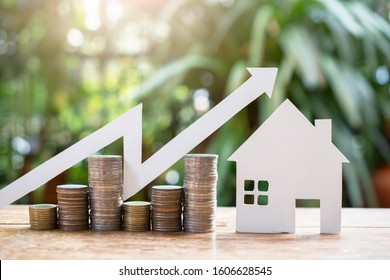 house model and money coins saving set increase for concept investment mortgage fund finance and home loan refinance